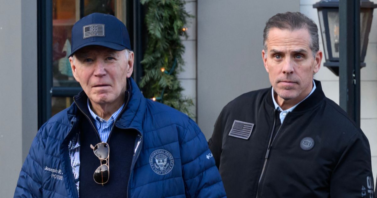 A photo shows President Joe Biden and son Hunter Biden stepping out of a bookstore while shopping in Nantucket, Massachusetts, on Nov. 29, 2024.