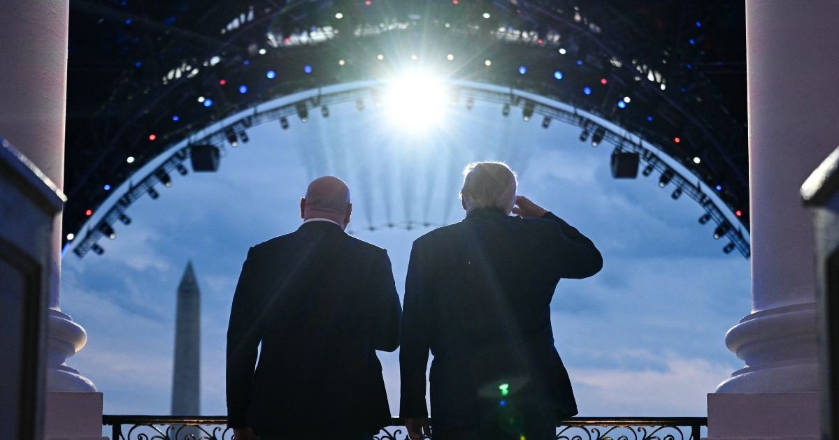 President Donald Trump and UFC CEO Dana White stand on the Blue Room Balcony of the White House as military jets perform a flyover during the UFC Freedom 250 Fight on the South Lawn of the White House on June 14, 2026, in Washington, D.C.