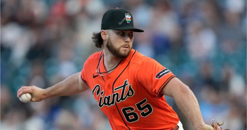 Landen Roupp of the San Francisco Giants pitches against the Chicago Cubs in the top of the first inning of a major league baseball game at Oracle Park on June 12, 2026, in San Francisco, California.