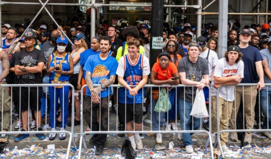 Fans look on during the New York Knicks Championship ticker tape parade and victory rally celebrating winning the 2026 NBA Finals on June 18, 2026, in New York City.