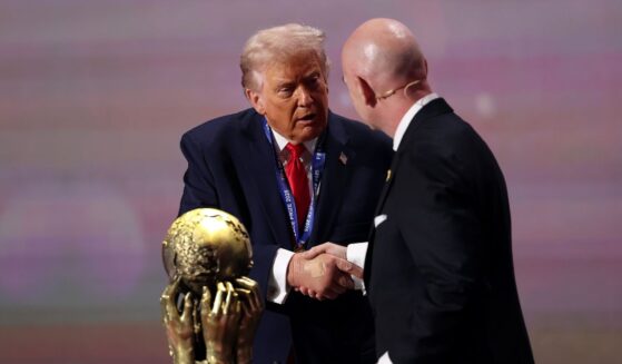 President Donald Trump receives the FIFA Peace Prize from Gianni Infantino, President of FIFA, during the FIFA World Cup 2026 Official Draw at John F. Kennedy Center for the Performing Arts on Dec. 5, 2025, in Washington, D.C.