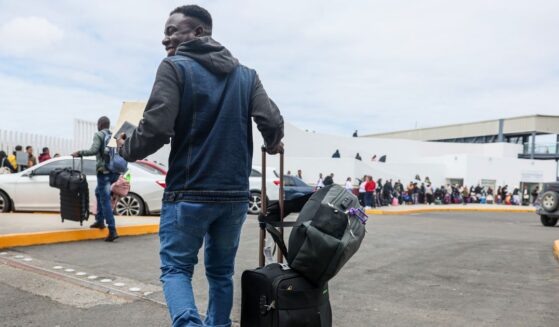 Lovenstar, a Haitian rap artist, joins hundreds of asylum seekers who used a CBP phone app to schedule an interview with U.S. agents at the San Ysidro Border Crossing in Tijuana, Mexico, on April 25, 2024.