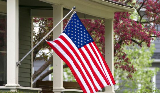 An American household has decided to mount their flag outside.
