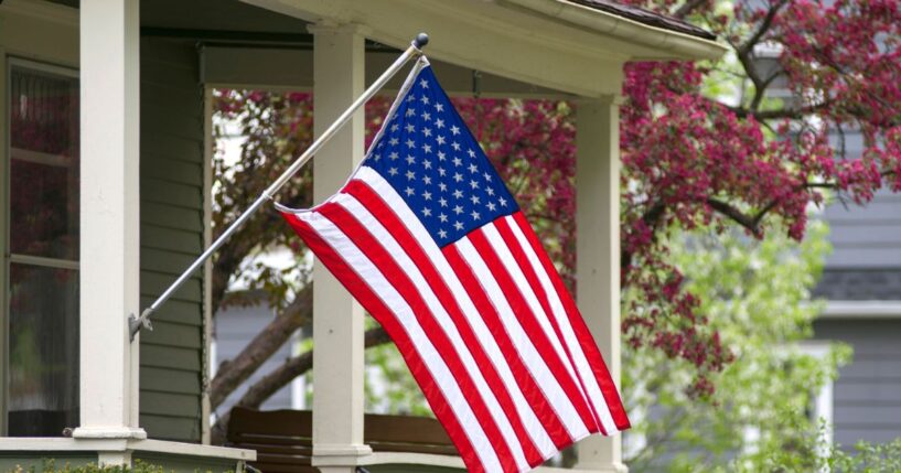 An American household has decided to mount their flag outside.