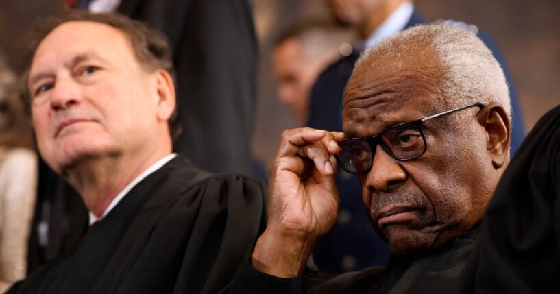 Supreme Court Associate Justices Samuel Alito and Clarence Thomas wait for their opportunity to leave the stage at the conclusion of the inauguration ceremonies in the Rotunda of the U.S. Capitol on Jan. 20, 2025, in Washington, D.C.