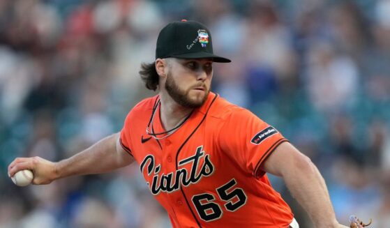 Landen Roupp of the San Francisco Giants pitches against the Chicago Cubs in the top of the first inning of a major league baseball game at Oracle Park on June 12, 2026, in San Francisco, California.
