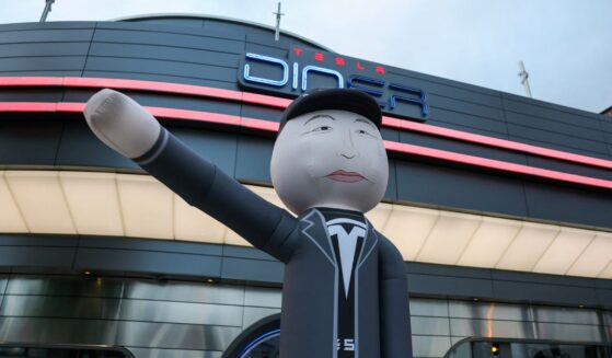 An inflatable tube man depicting businessman and entrepreneur Elon Musk is displayed during the "Tyrant Diner" protest, calling for a boycott of Tesla, outside of the Tesla Diner and Drive-In Restaurant and Supercharger on Santa Monica Blvd in the Hollywood neighborhood of Los Angeles, California, on Sept. 26, 2025.