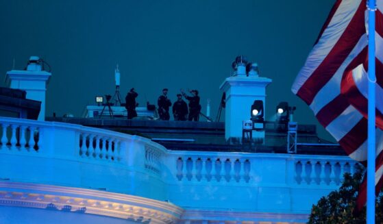 Secret Service agents are seen atop the White House during UFC Freedom 250 on the South Lawn on June 14, 2026, in Washington, D.C.