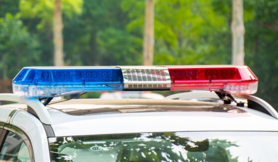 Police lights on a car during traffic surveillance on the city road.