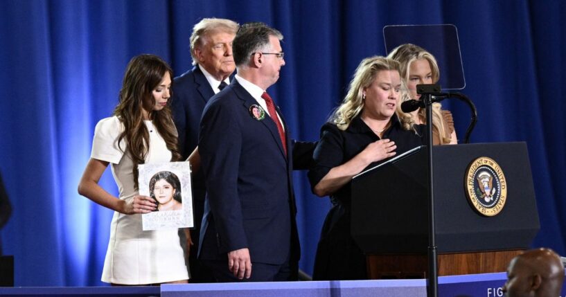 President Donald Trump listens as Jessica Gorman, mother of Sheridan Gorman, speaks during an event on the economy at Rockland Community College Fieldhouse in Suffern, New York, on May 22, 2026.