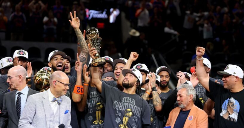 Jalen Brunson of the New York Knicks lifts the Bill Russell NBA Finals Most Valuable Player Award trophy after defeating the San Antonio Spurs in Game Five of the 2026 NBA Finals at Frost Bank Center on June 13, 2026, in San Antonio, Texas.