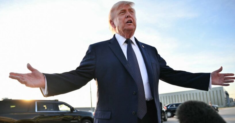 President Donald Trump gestures as he addresses the media on the tarmac after arriving at Paris Orly Airport en route to a dinner to celebrate the 250th anniversary of the independence of the United States, at Orly Airport, south of Paris, on June 17, 2026.