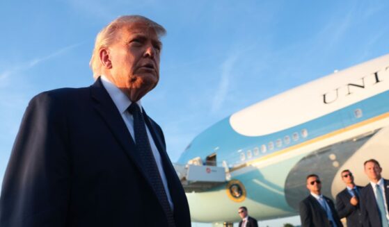 President Donald Trump walks to speak to reporters as he arrives at Orly Airport to attend a dinner with French President Emmanuel Macron at Chateau de Versailles on June 17, 2026, in Orly, France.