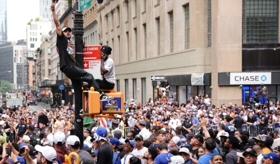 Fans line the street during the New York Knicks Championship ticker tape parade and victory rally celebrating winning the 2026 NBA Finals on June 18, 2026, in New York City.