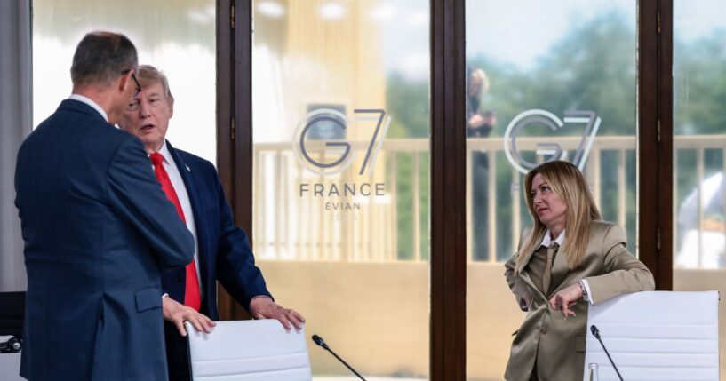 President Donald Trump speaks with German Chancellor Friedrich Merz next to Italian Prime Minister Giorgia Meloni at a working lunch with leaders of G7 and the Middle East, on June 16, 2026, in Evian-les-Bains, France.