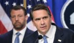Acting Attorney General Todd Blanche, alongside Secretary of Homeland Security Markwayne Mullin, speaks during a press conference about safeguarding unaccompanied immigrant children at the Department of Justice headquarters in Washington, D.C., on June 11, 2026.