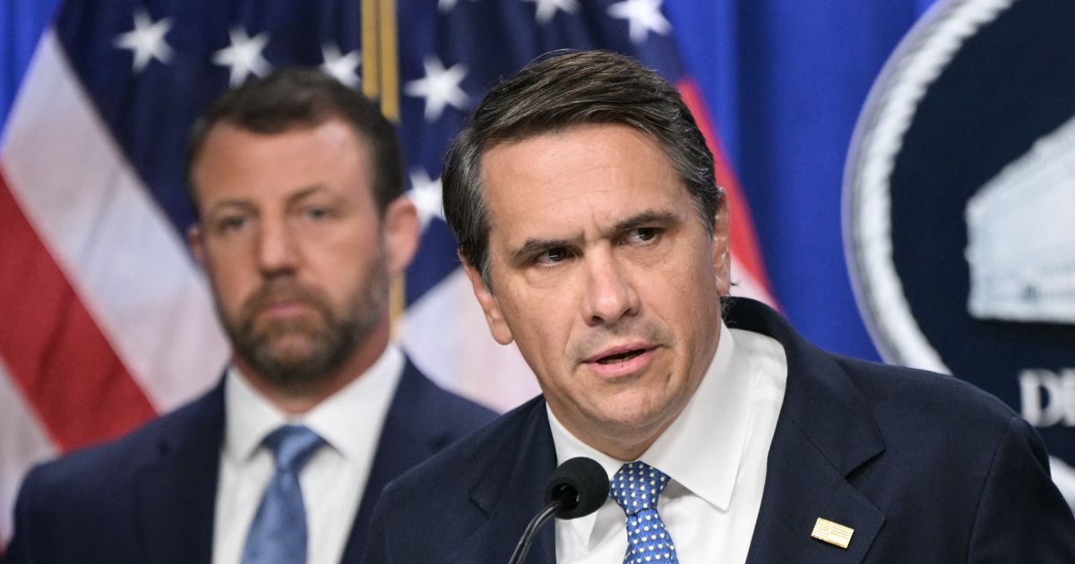 Acting Attorney General Todd Blanche, alongside Secretary of Homeland Security Markwayne Mullin, speaks during a press conference about safeguarding unaccompanied immigrant children at the Department of Justice headquarters in Washington, D.C., on June 11, 2026.