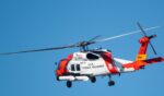 A U.S. Coast Guard Sikorsky MH-60T Jayhawk helicopter approaches the U.S. Coast Guard Sector San Diego air station on Dec. 20, 2024, in San Diego, California.