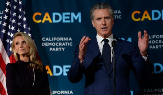 California Gov. Gavin Newsom and his wife, Jennifer Siebold Newsom, left, are pictured in a November file photo as election returns come in for a ballot measure that allowed California to redistrict its congressional delegation to elect more Democrats.