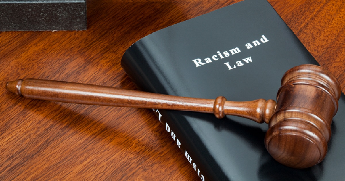 A gavel over a book tiled "Racism and Law."