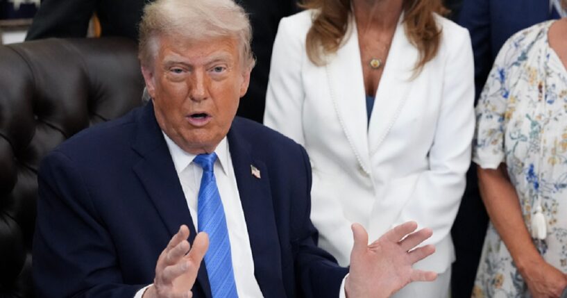 President Donald Trump addresses reporters in the Oval Office on Wednesday.