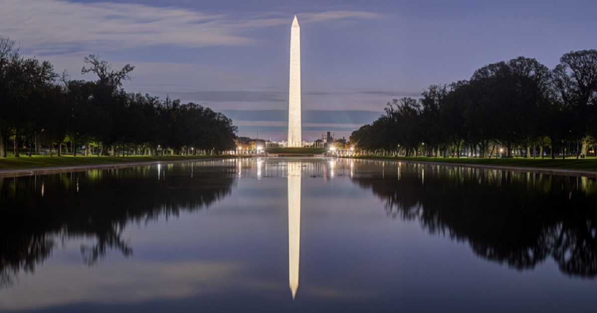 The Washington Monument is reflected in the National Mall's Reflecting Pool in an April 2025 twilight photo.