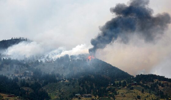 Smoke fills a mountain sky in a file photo from a 2012 wildfire in Colorado.