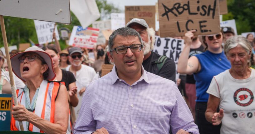 Nirav Shah, Democratic candidate for U.S. Senate, marches during a demonstration outside of a federal immigration office after a man was fatally shot by U.S. Immigration and Customs Enforcement agents, on July 14, 2026, in Scarborough, Maine.