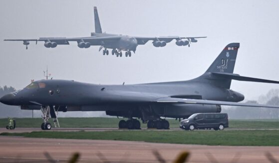 A U.S. Air Force Boeing B-52 Stratofortress bomber jet lands on the runway, beyond a USAF Rockwell B-1 Lancer bomber jet, at RAF Fairford in southwest England on March 9, 2026.