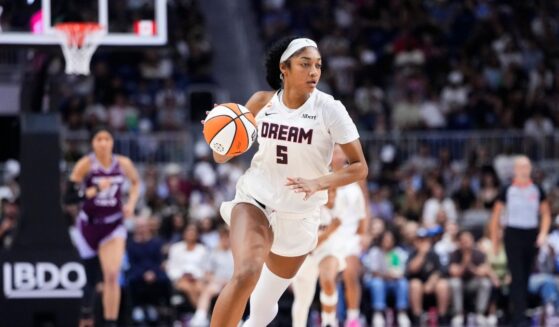 Angel Reese of the Atlanta Dream dribbles the ball through mid-court against the Toronto Tempo during the second half of their WNBA basketball game at the Coca-Cola Coliseum on July 17, 2026, in Toronto, Ontario, Canada.