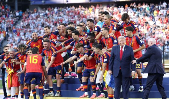 Rodri of Spain prepares to lift the FIFA World Cup Winner’s Trophy as FIFA President Gianni Infantino directs President Donald Trump after the team’s victory following during the FIFA World Cup 2026 Final match between Spain and Argentina at New York New Jersey Stadium on July 19, 2026, in East Rutherford, New Jersey.