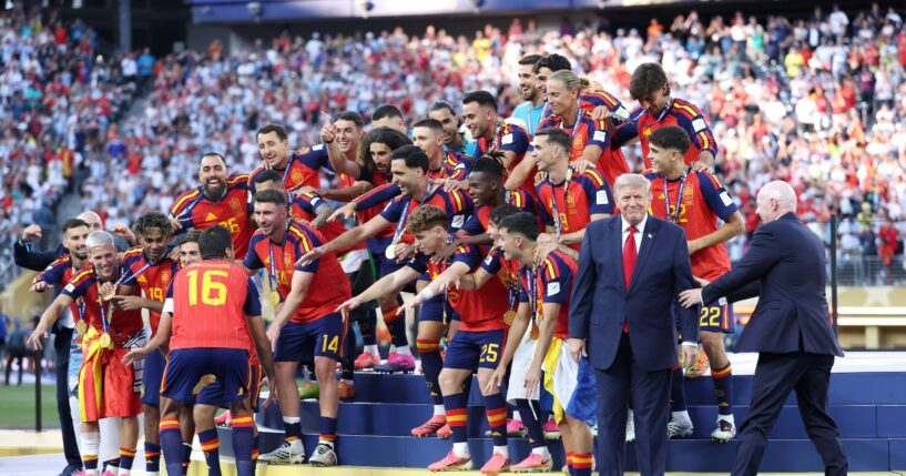 Rodri of Spain prepares to lift the FIFA World Cup Winner’s Trophy as FIFA President Gianni Infantino directs President Donald Trump after the team’s victory following during the FIFA World Cup 2026 Final match between Spain and Argentina at New York New Jersey Stadium on July 19, 2026, in East Rutherford, New Jersey.