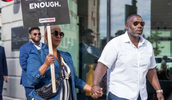 Rep. Ayanna Pressley and her husband, Conan Harris, join picketing hotel workers at the Boston Park Plaza Hotel on Sept. 2, 2024, in Boston, Massachusetts.