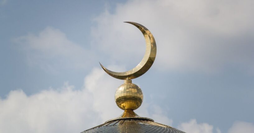 The Islamic crescent on a mosque.