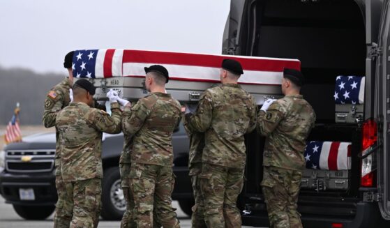 A U.S. Army carry team transports a flag-draped transfer case to a vehicle during a dignified transfer at Dover Air Force Base on March 7, 2026, in Dover, Delaware.