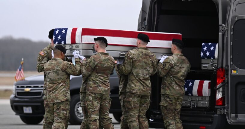 A U.S. Army carry team transports a flag-draped transfer case to a vehicle during a dignified transfer at Dover Air Force Base on March 7, 2026, in Dover, Delaware.