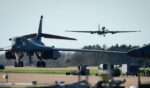A Lockheed U-2 "Dragon Lady" high–altitude reconnaissance aircraft comes into land beyond two parked Rockwell B-1 Lancer heavy bombers at RAF Fairford on March 18, 2026, in Fairford, England.