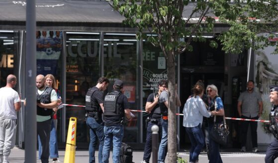 Judicial police work in a cordoned off area after a knife-wielding man wounded three people in Paris on July 27, 2026.