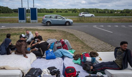 Asylum seekers camp out close to an application center in Ter Apel in the Netherlands on Aug. 28, 2022.