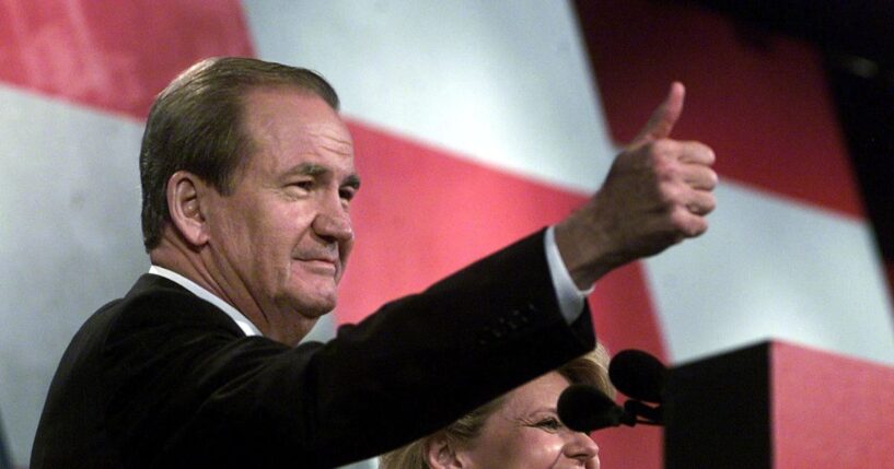 Reform Party presidential candidate Pat Buchanan, flanked by his wife Shelly, gives the thumbs-up to supporters after his Aug. 12, 2000, speech at the Reform Party National Convention in Long Beach, California.