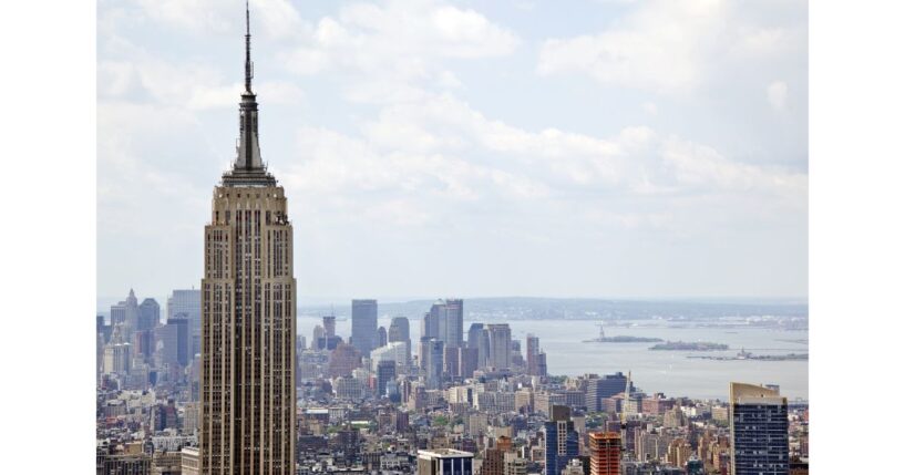 The couple climbed to the very top of the famed New York City landmark - with no safety equipment.