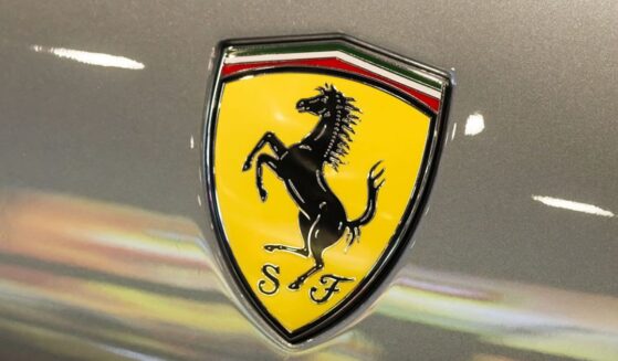 A Ferrari shield emblem is displayed on a vehicle during a June 3 auto show in Shenzhen, Guangdong Province, China.