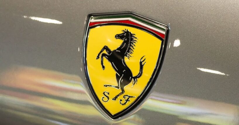 A Ferrari shield emblem is displayed on a vehicle during a June 3 auto show in Shenzhen, Guangdong Province, China.