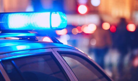 Flashing blue lights above a law-enforcement vehicle.