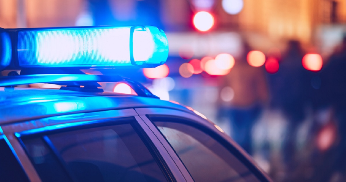 Flashing blue lights above a law-enforcement vehicle.