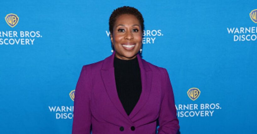 “CNN This Morning” host Audie Cornish stands at a red carpet in a purple pantsuit on May 15, 2025.