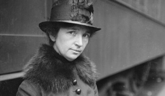 Margaret Sanger is pictured standing near a train in Chicago circa 1917.