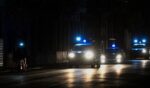 Police lights flash on a dark road in Havana on March 21, 2026.
