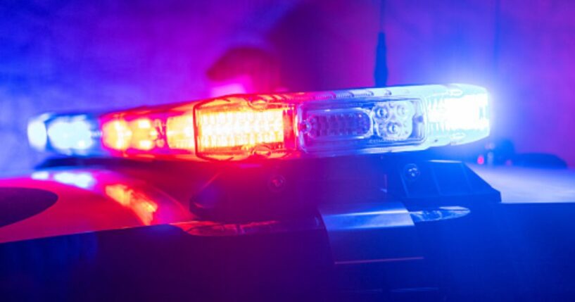 Police car lights flash.