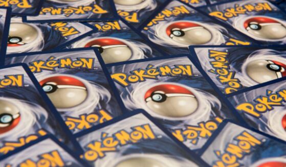 Pokémon Cards lay on a table.